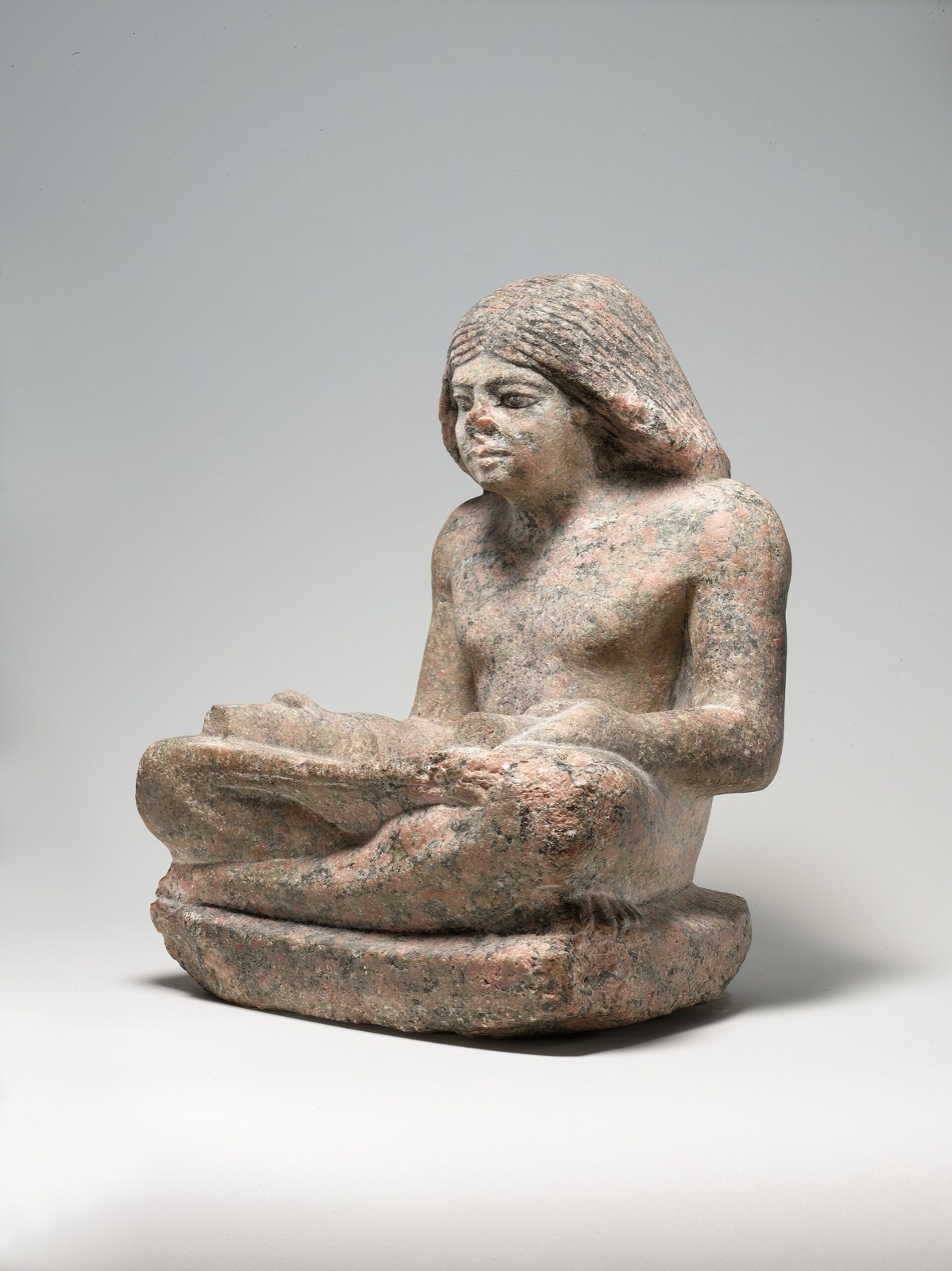 Nikare seated as a scribe